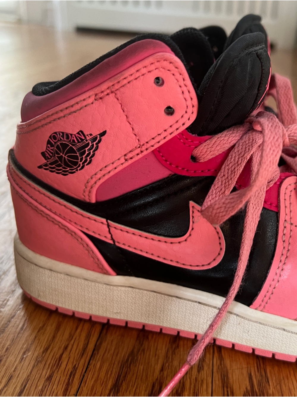 Air Jordan 1 Nike Kids Pink and Black High-Top Sneakers